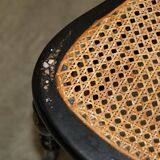 Four antique Regency bergère chairs with mother-of-pearl inlay.