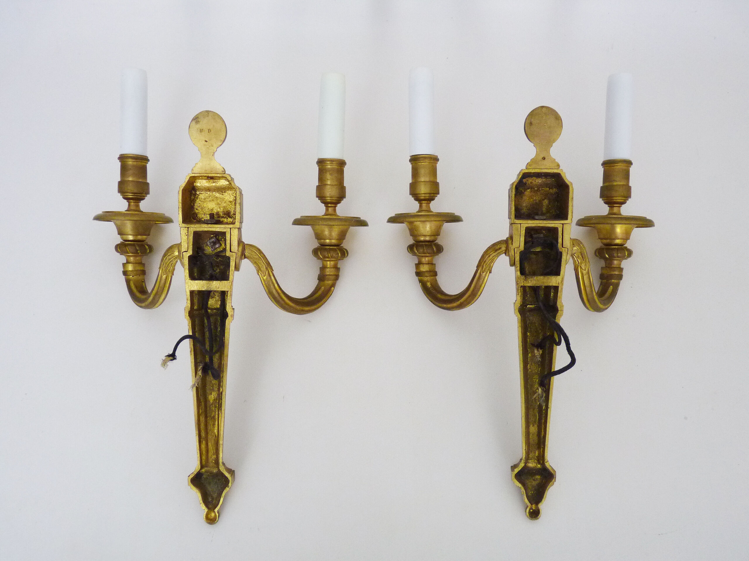 Old pair of bronze double fire wall sconces, signed md