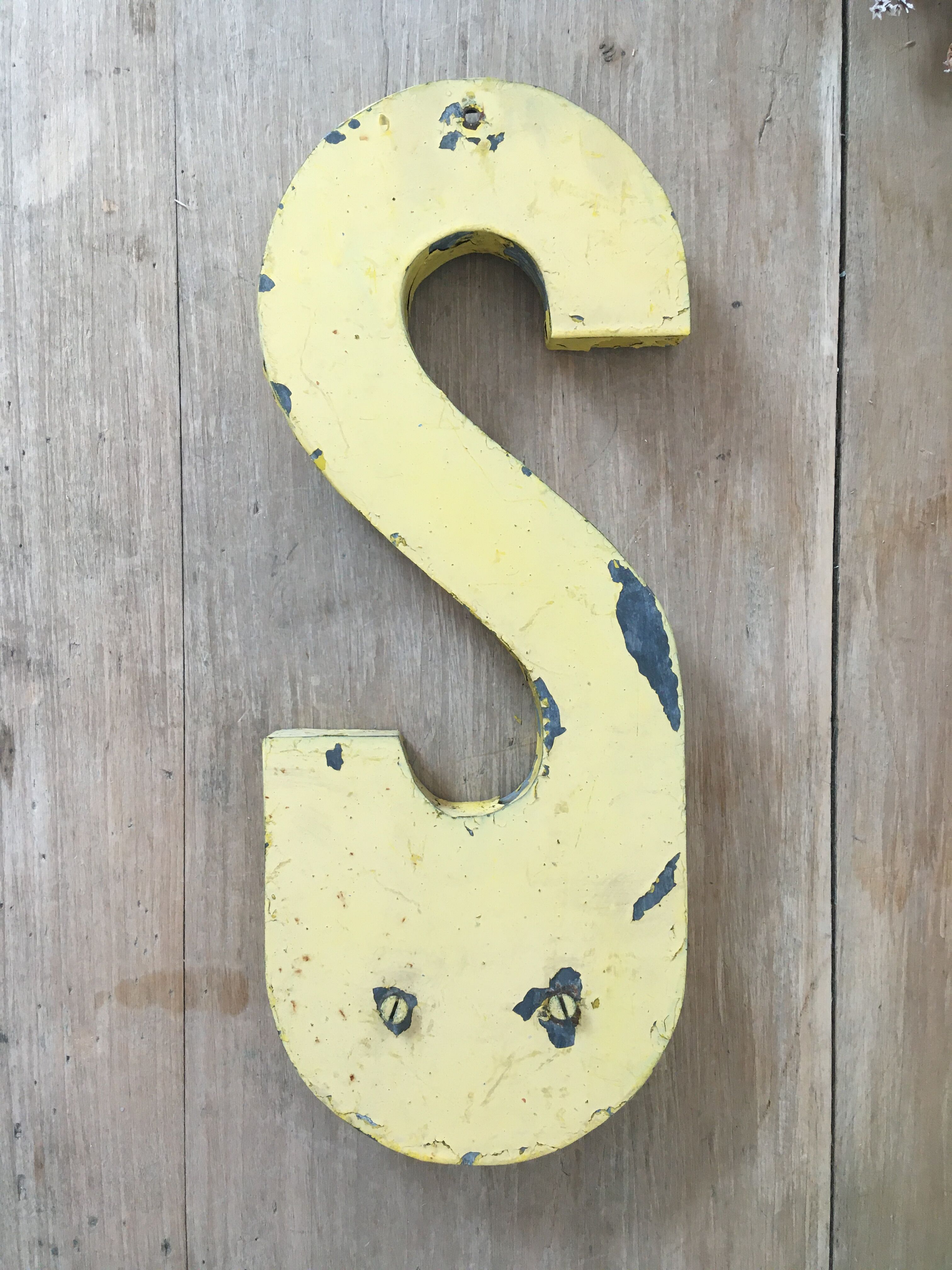 Vintage yellow sign letter S