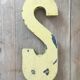 Vintage yellow sign letter S