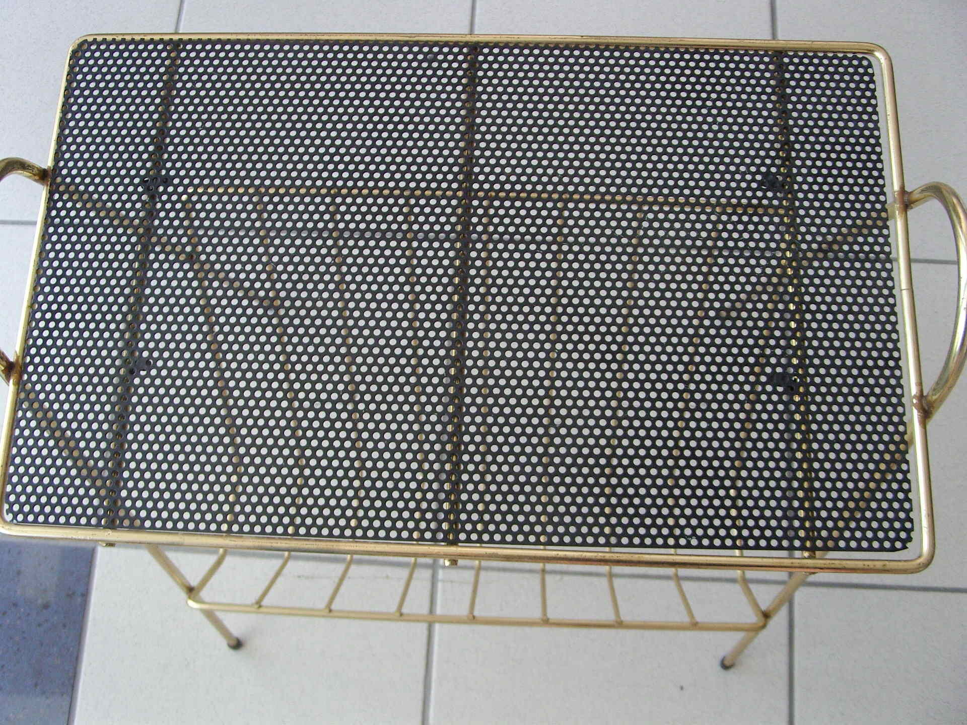 Vintage magazine door in gold metal and open