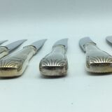 12 silver metal knives.