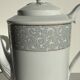 Bavarian porcelain teapot from Germany with blue frieze and flower lid H23