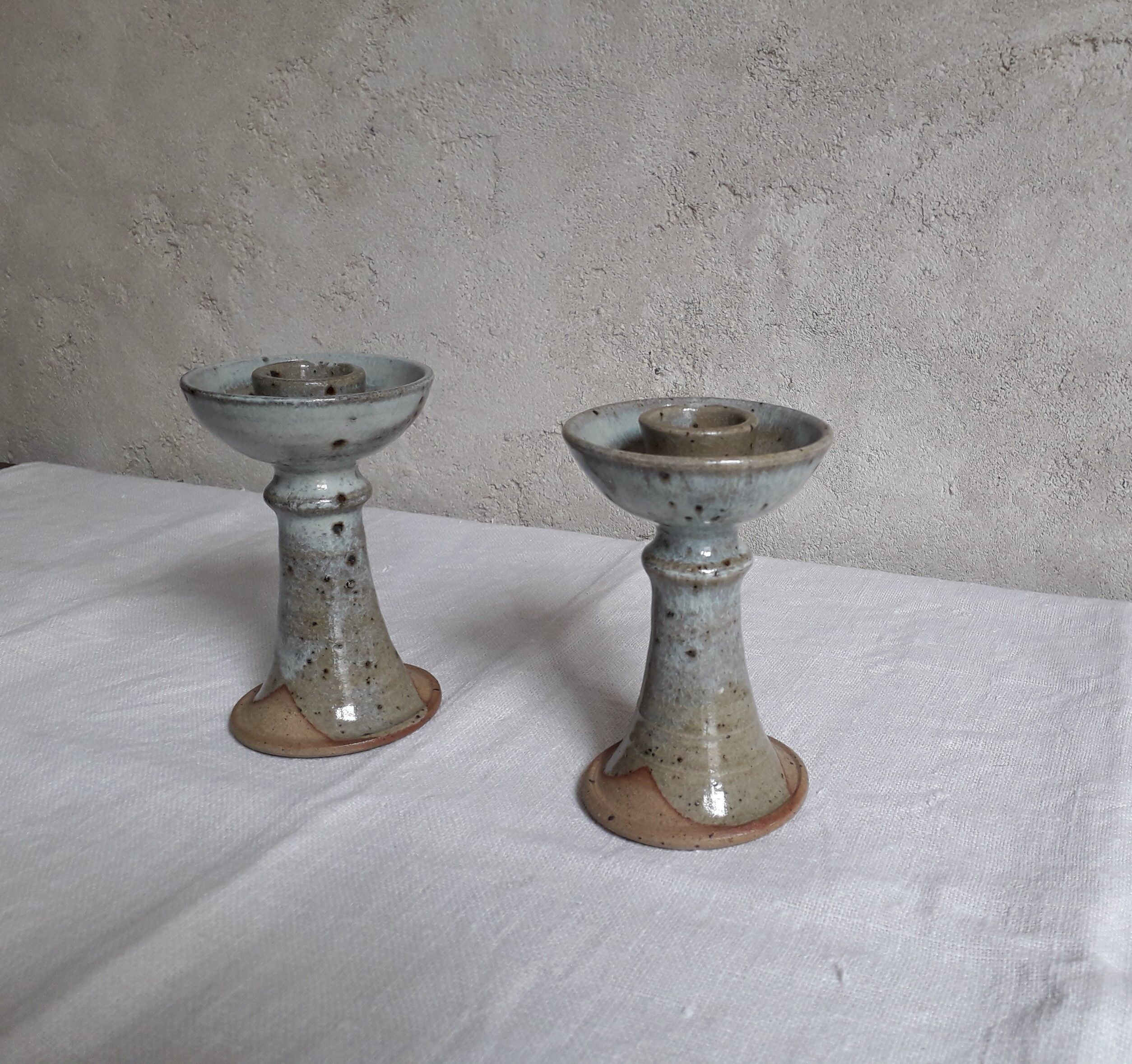 Pair of sandstone candlesticks