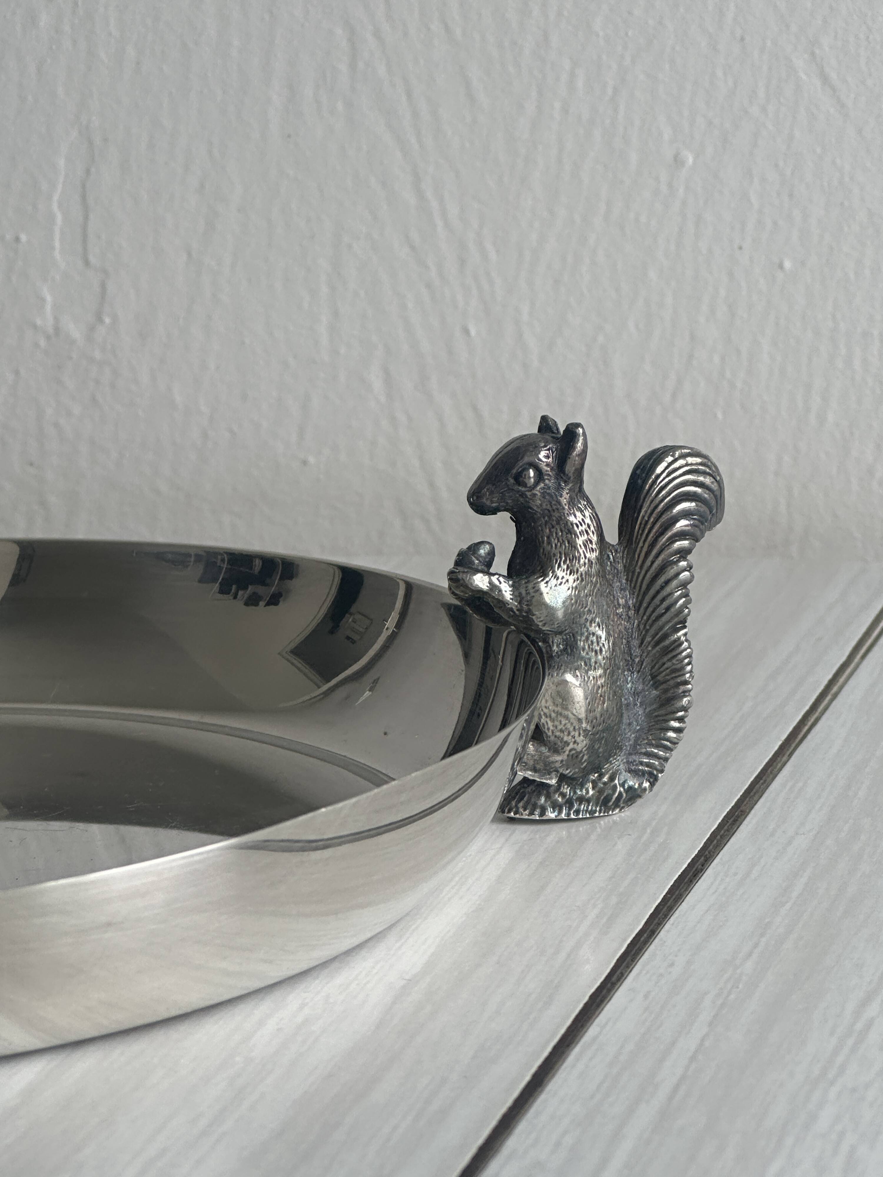 Small shiny silver metal dish