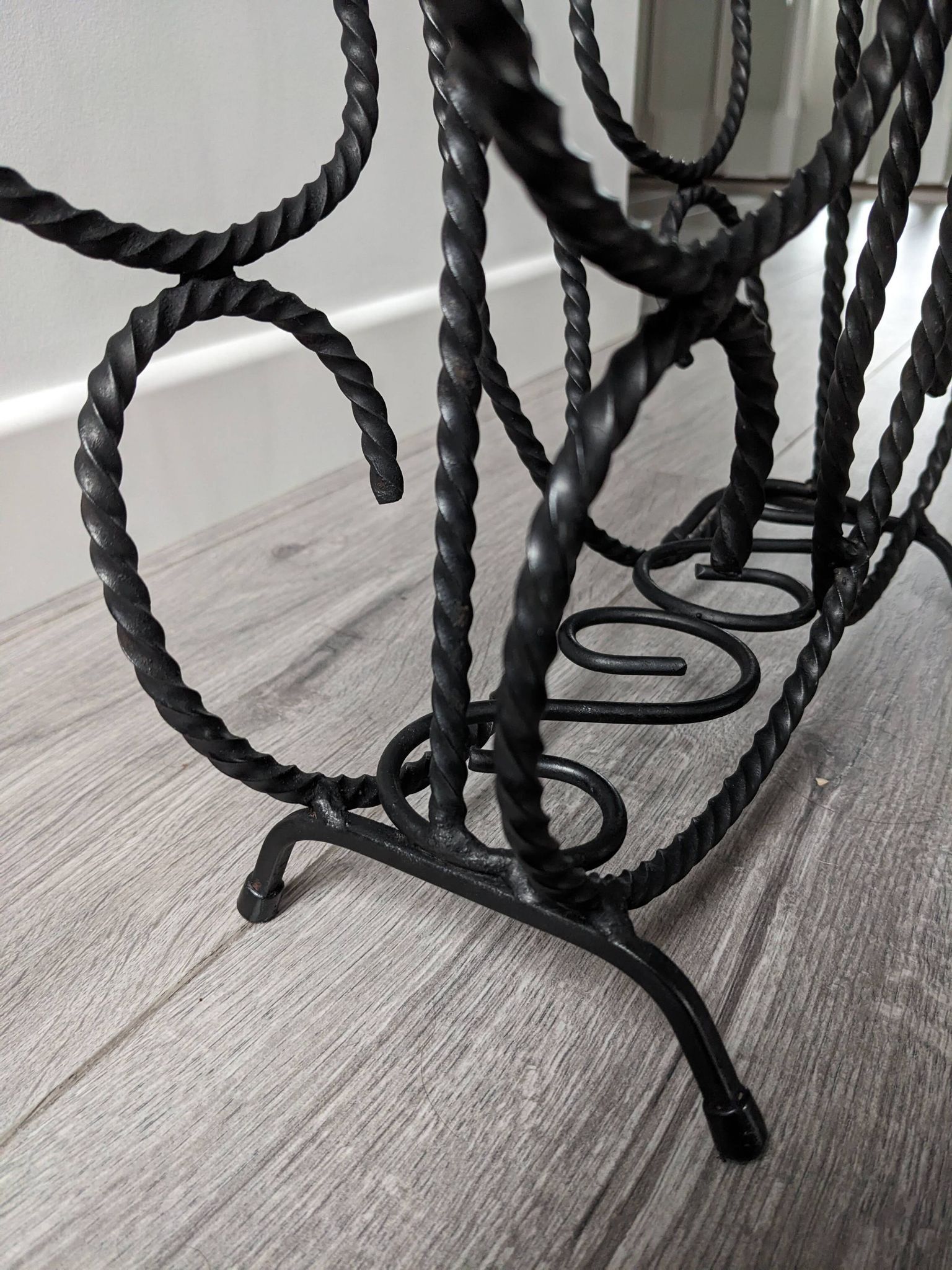 Vintage wrought iron magazine rack