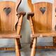 Pair of rustic oak armchairs – carved heart backrests