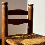 Low fireplace chair attributed to Charles Dudouyt.