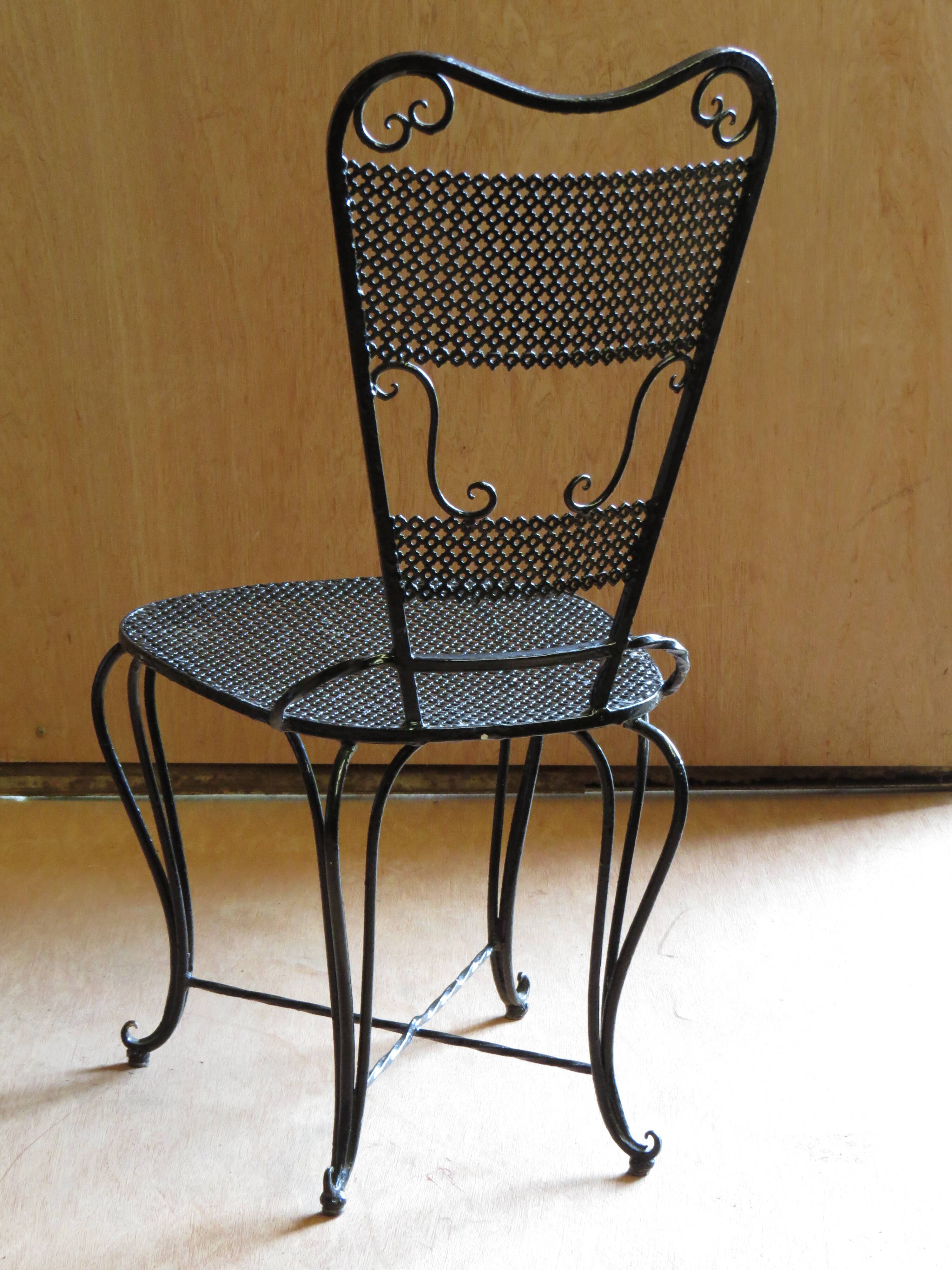 Pair of black lacquered wrought iron garden chairs