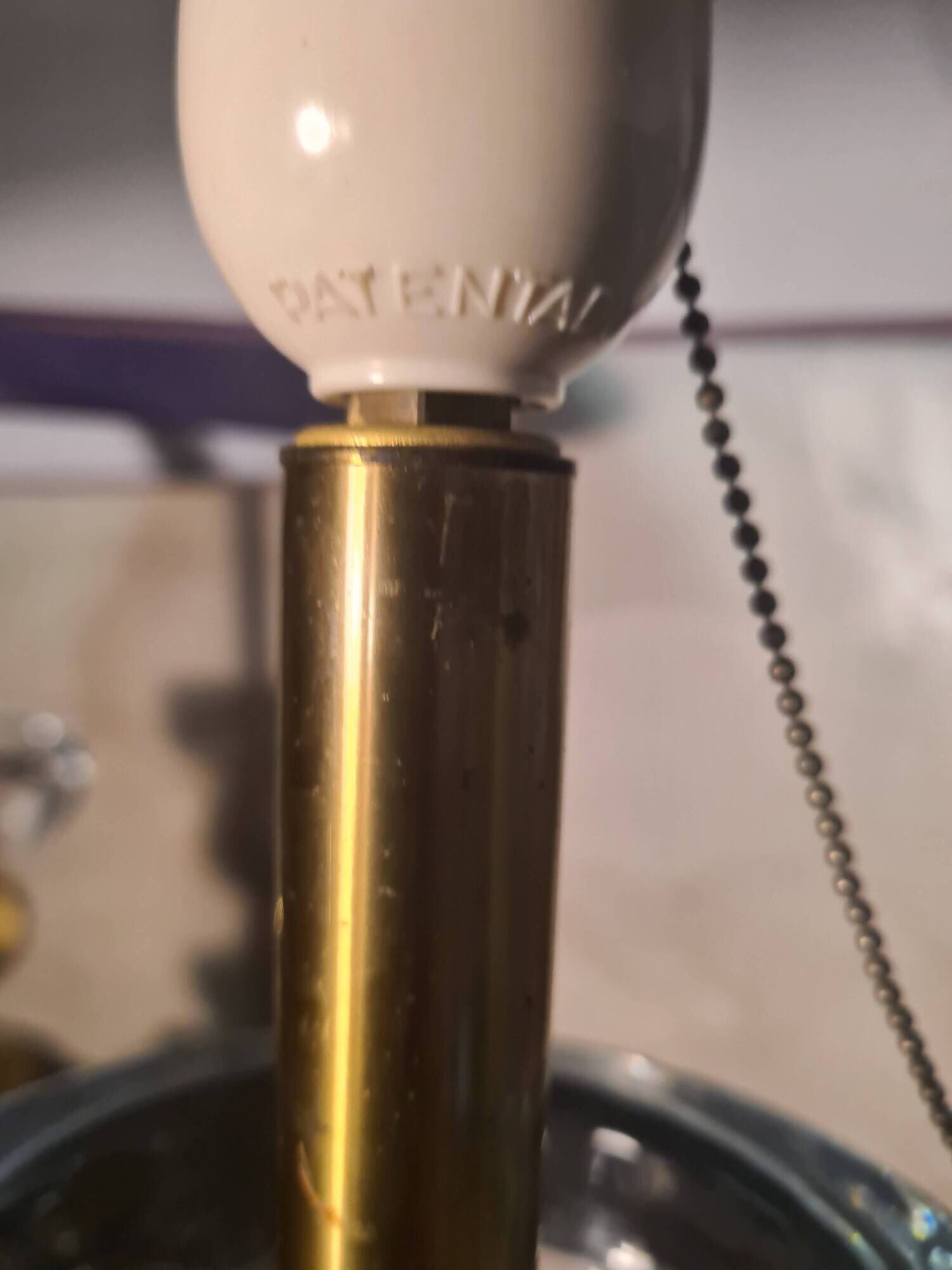 A pair of vintage table lamps featuring a turned wooden base, accessories...