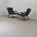 2 x Scandinavian black leather lounge chairs