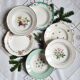 Old hollow plates mismatched in earthenware