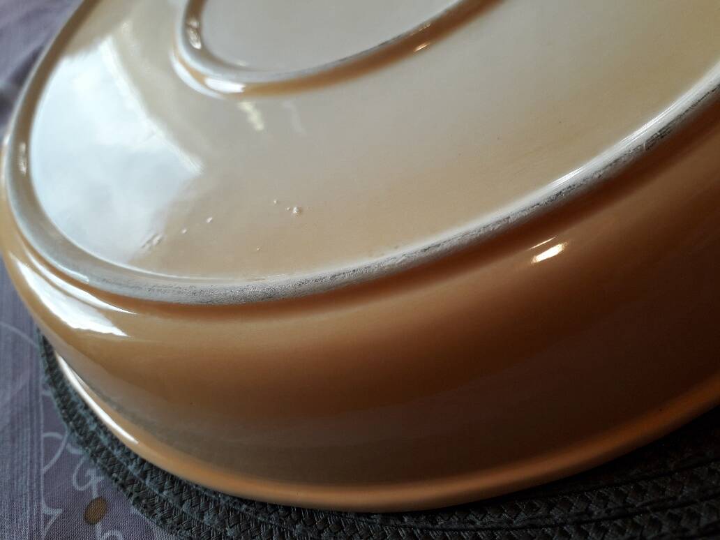 Glazed ceramic dessert plate with strawberry design.