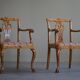 A pair of English Chippendale style armchairs in birch, 20th century, England.