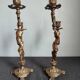 Pair of antique candlesticks in cherub bronze