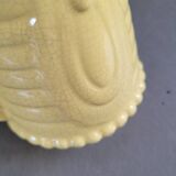 Yellow milk jug with reliefs