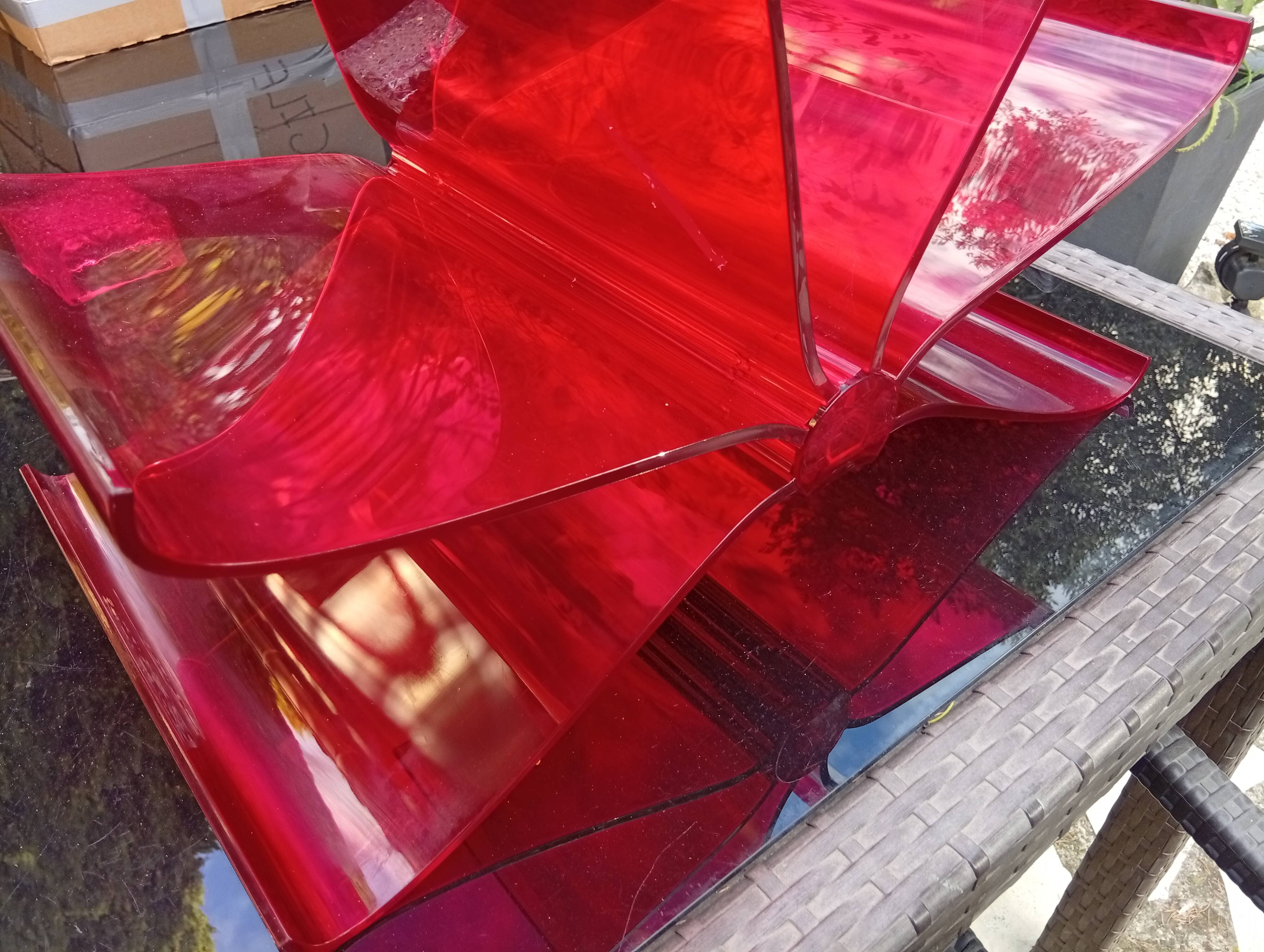 Kartell red magazine rack