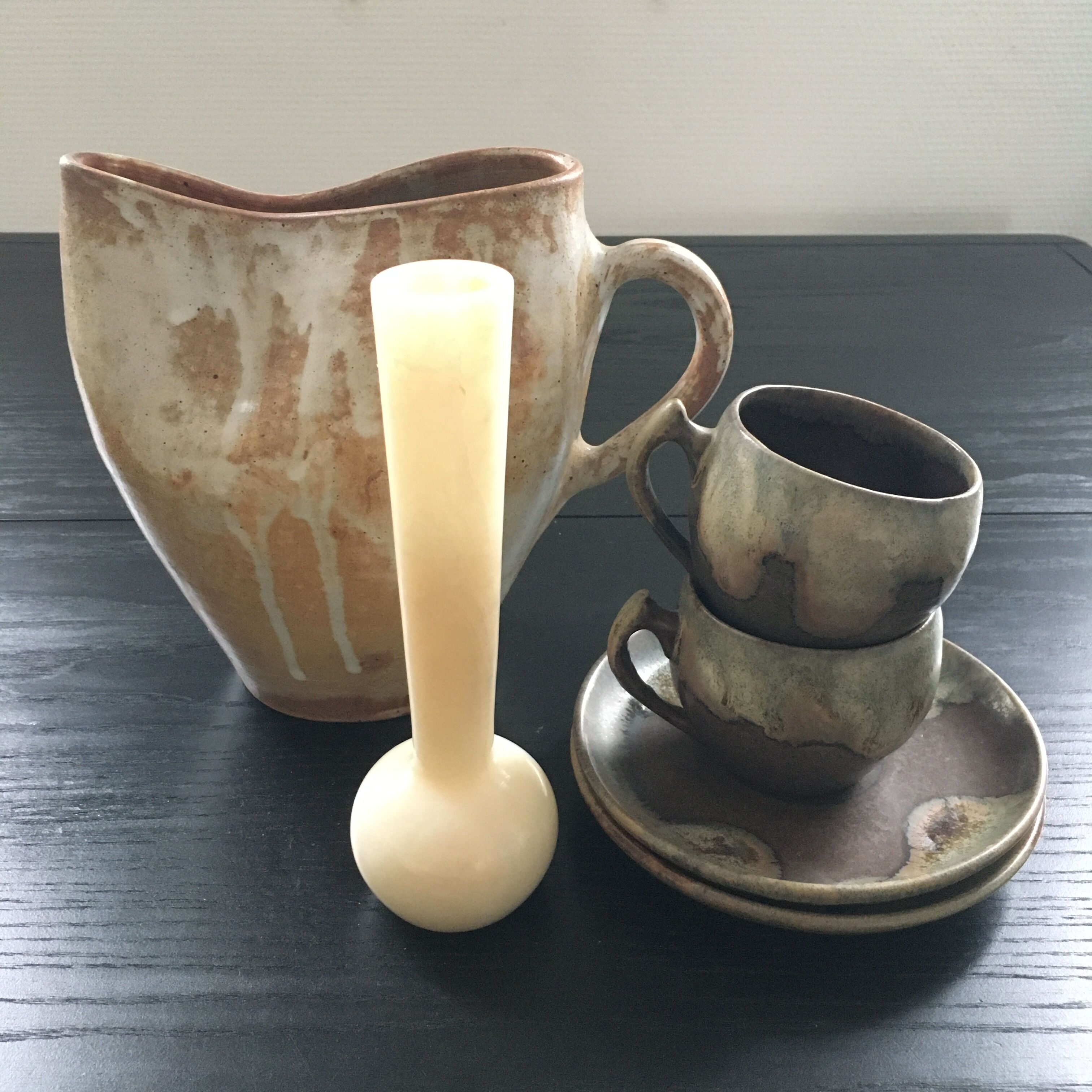 Beige stoneware pitcher with white drips