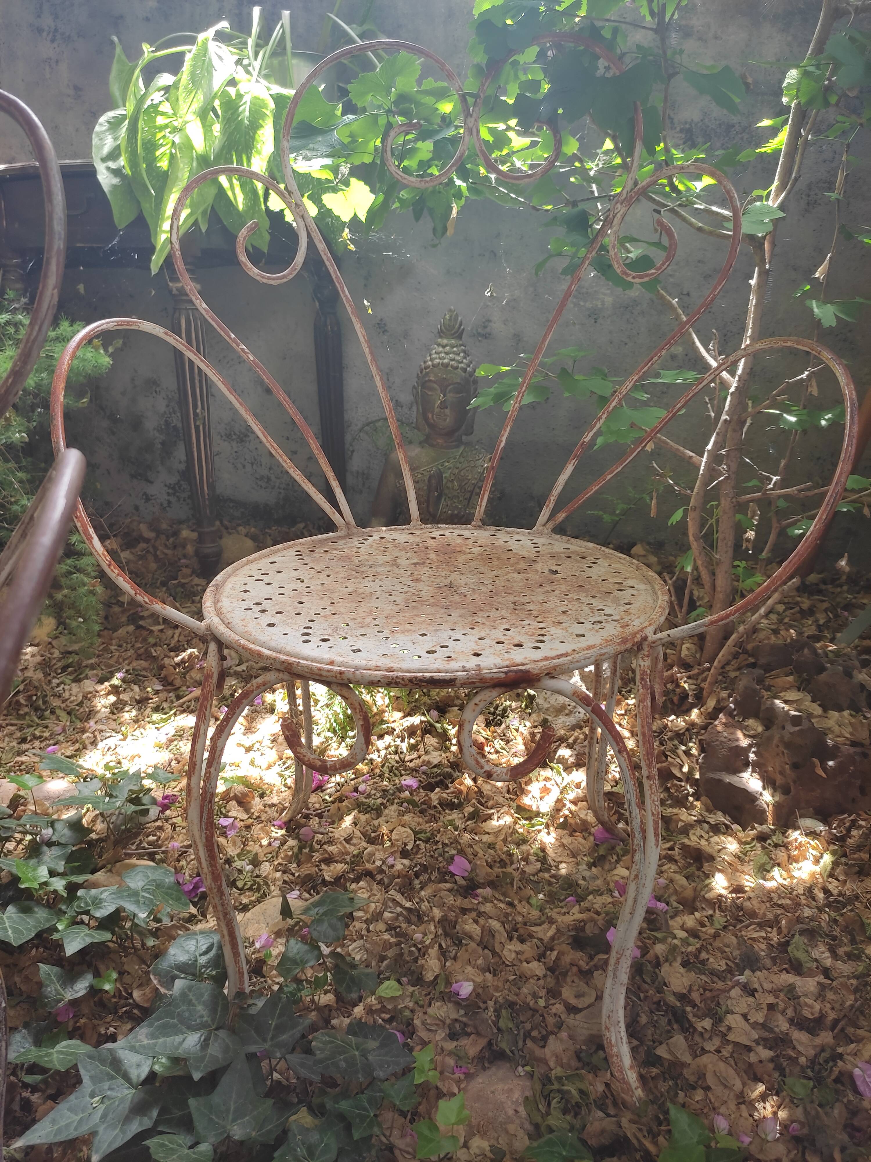 Duo of iron lawn chairs