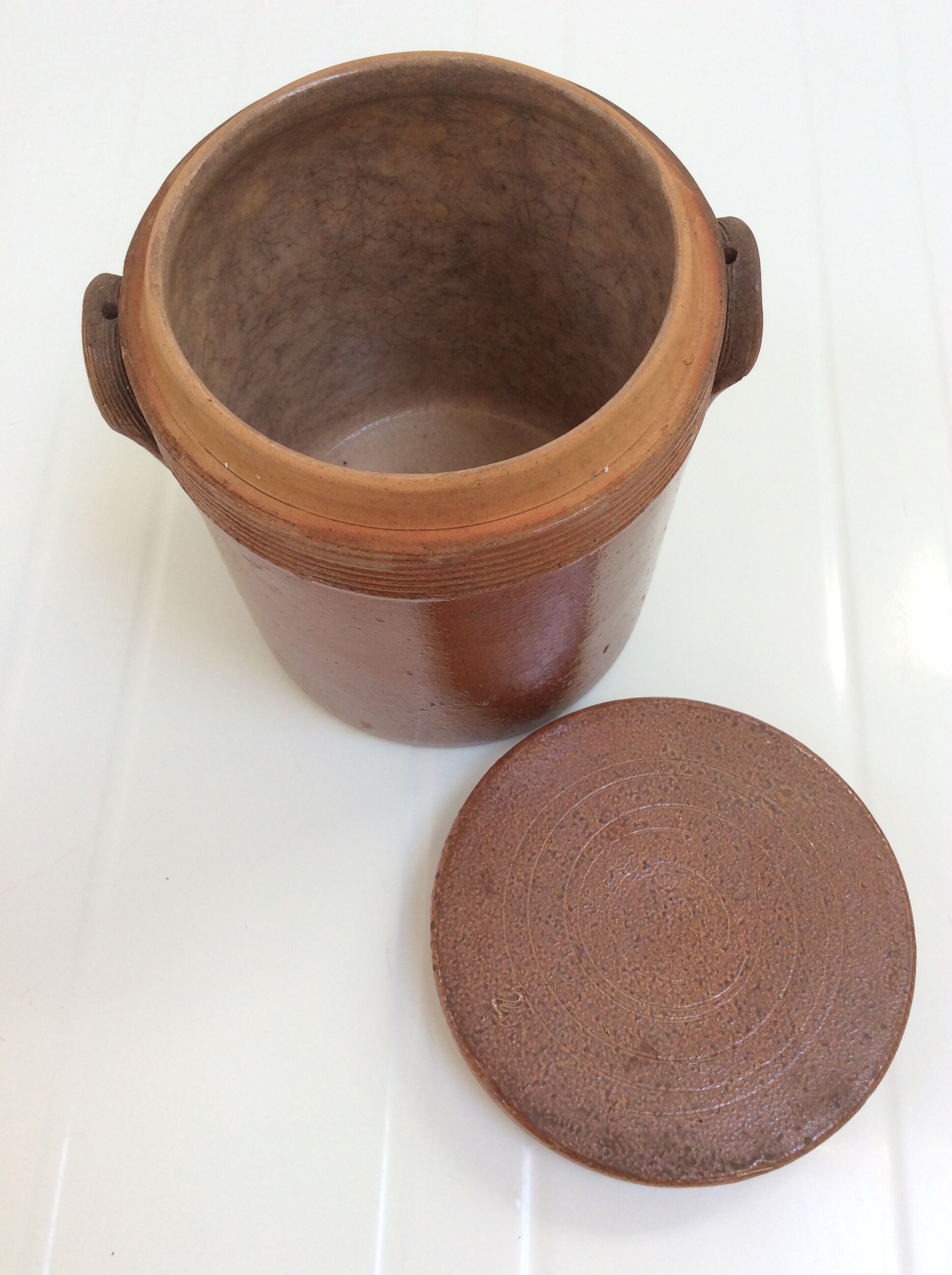 Old stoneware pot with lid