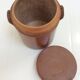 Old stoneware pot with lid