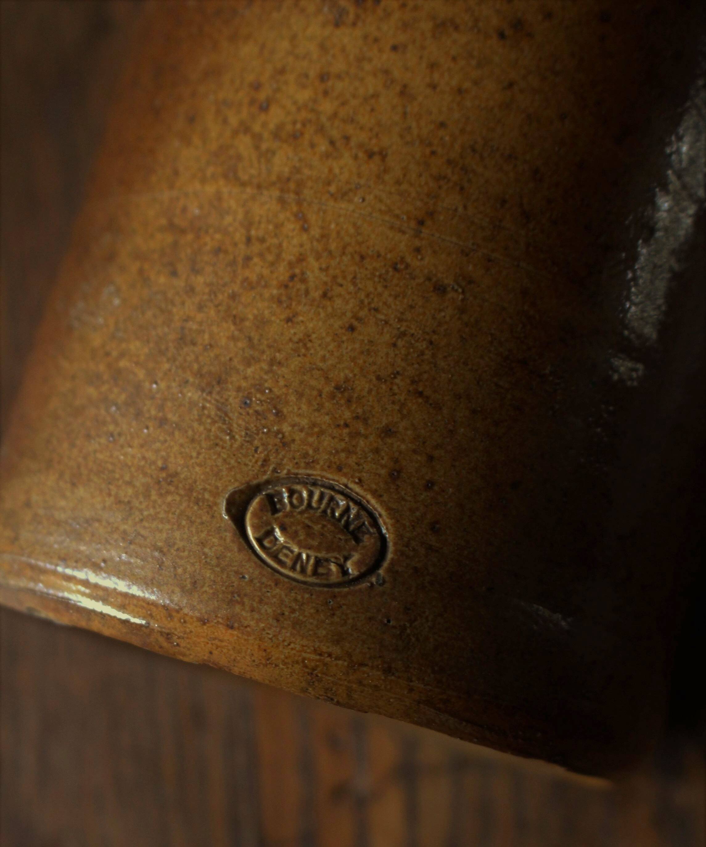 Vintage Bourne Deney stoneware liqueur bottle with pouring spout.