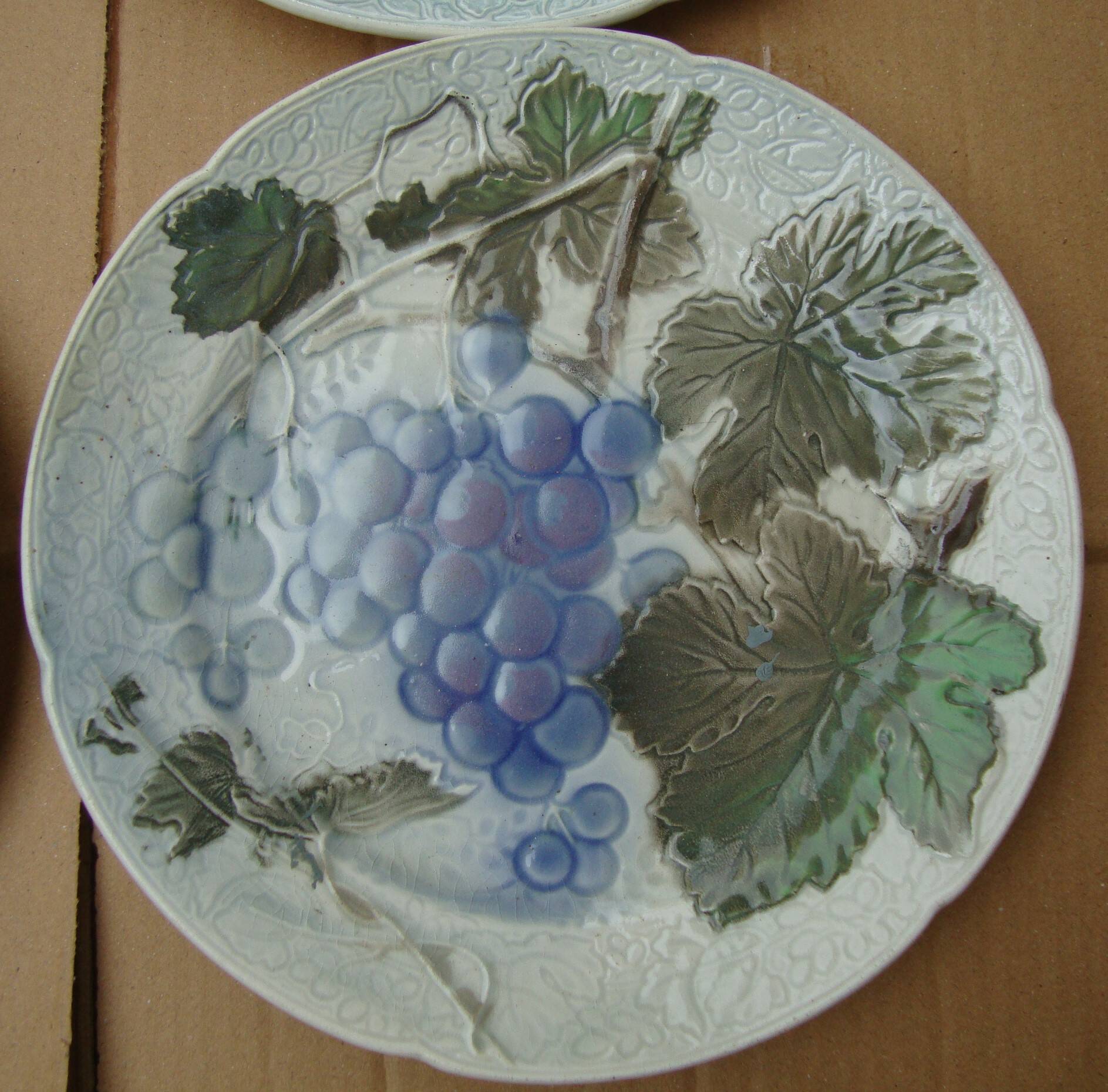 Set of 4 Keller and Guerin St Clement Majolica plates with fruit decoration.
