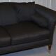 Three-seater Art Deco canapé with a light hardwood frame.