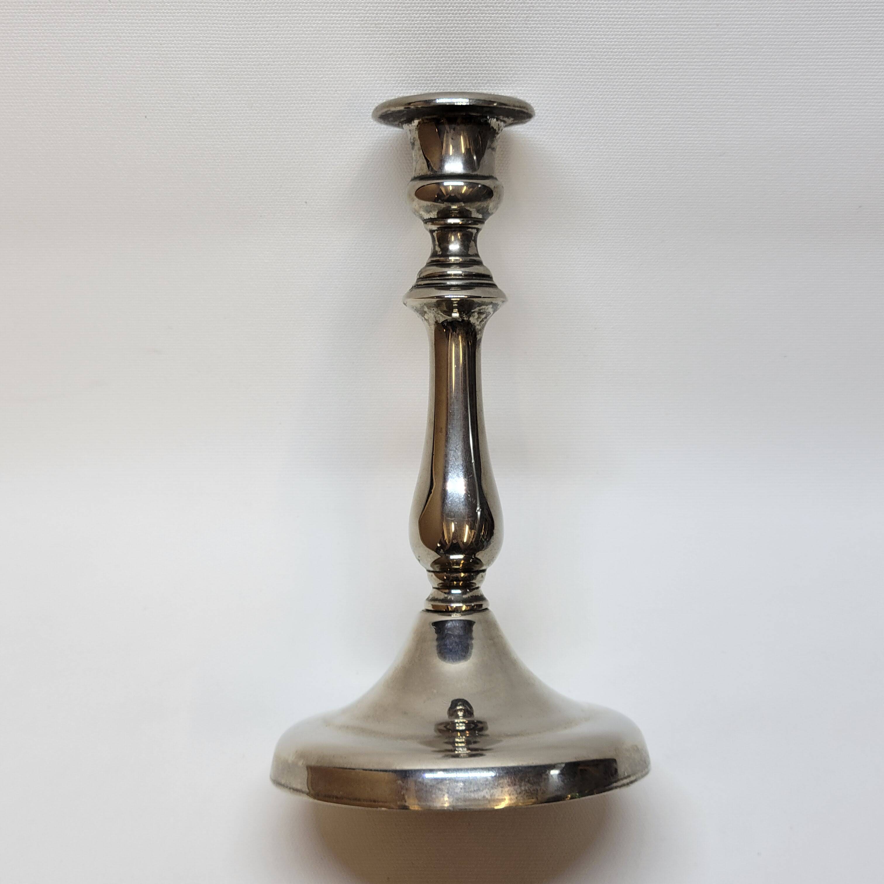Old candle holder in silver metal