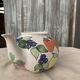 Vintage coloured ceramic jug in cream white with hand-painted decoration (Hungary)