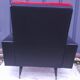 Black leatherette armchair and red fur