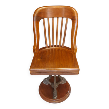 Swivel American chair in walnut and cast iron