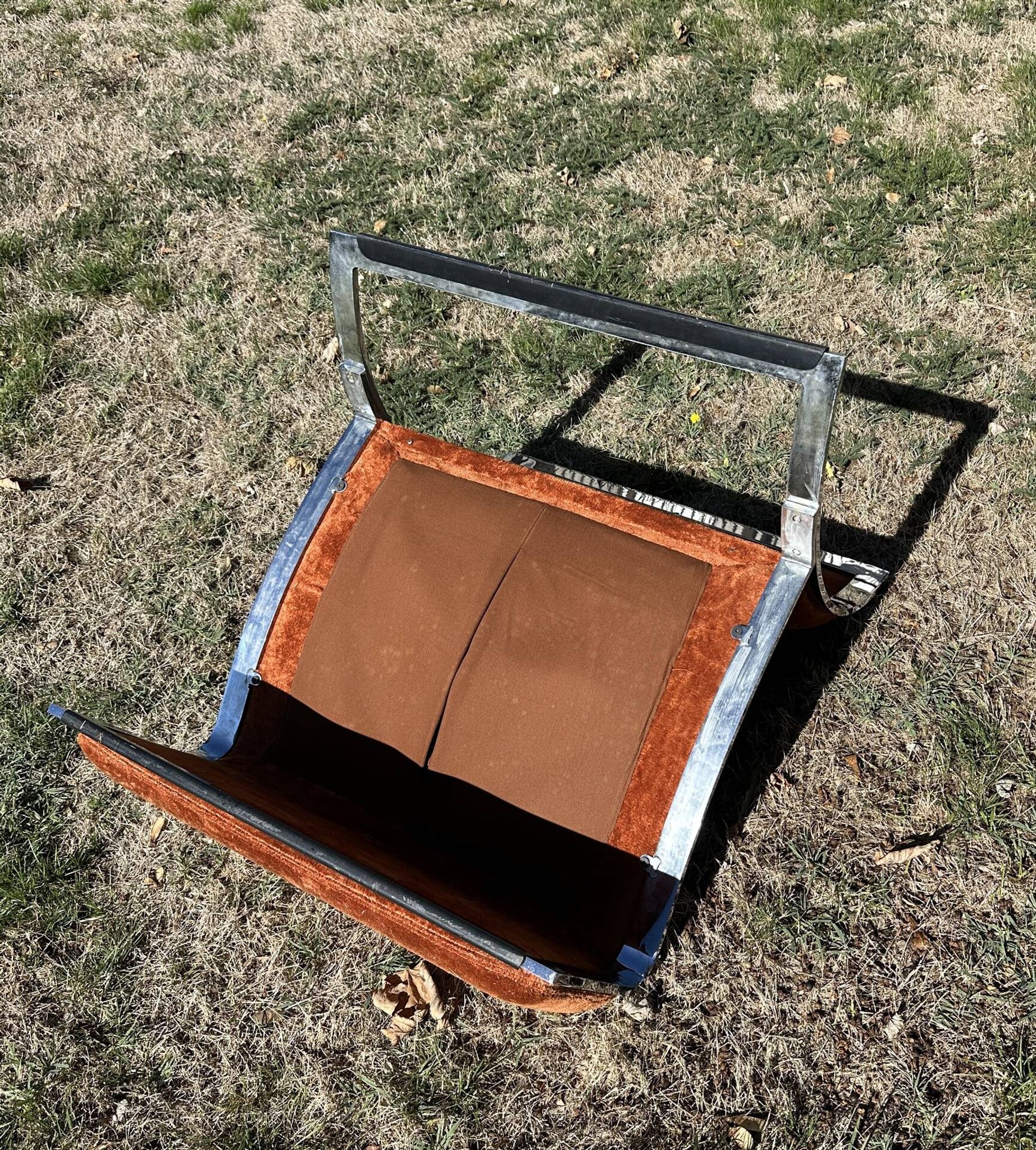 Chrome steel armchair and orange fabric by Vittorio Introini