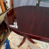 Empire style dining table with two sliding elements.