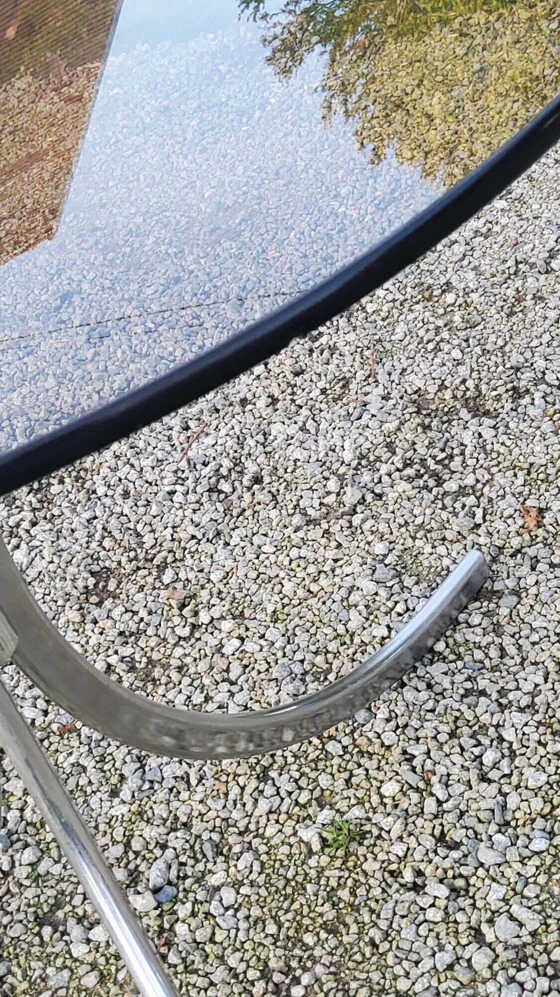 Designer table from the 70s, smoked glass top, chrome base