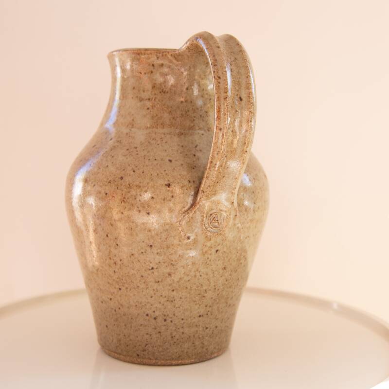 Stoneware carafe signed CA on handle