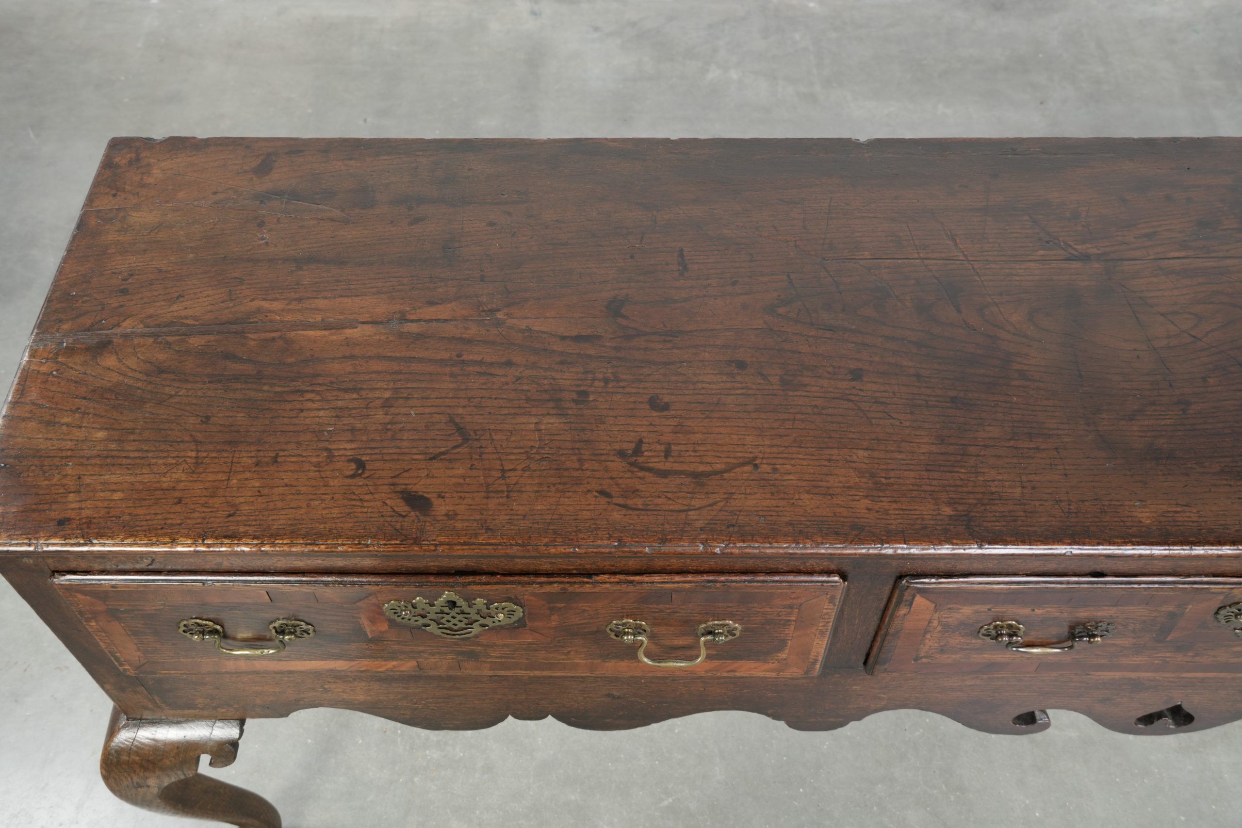Large antique English oak sideboard from the 18th century with elegant legs