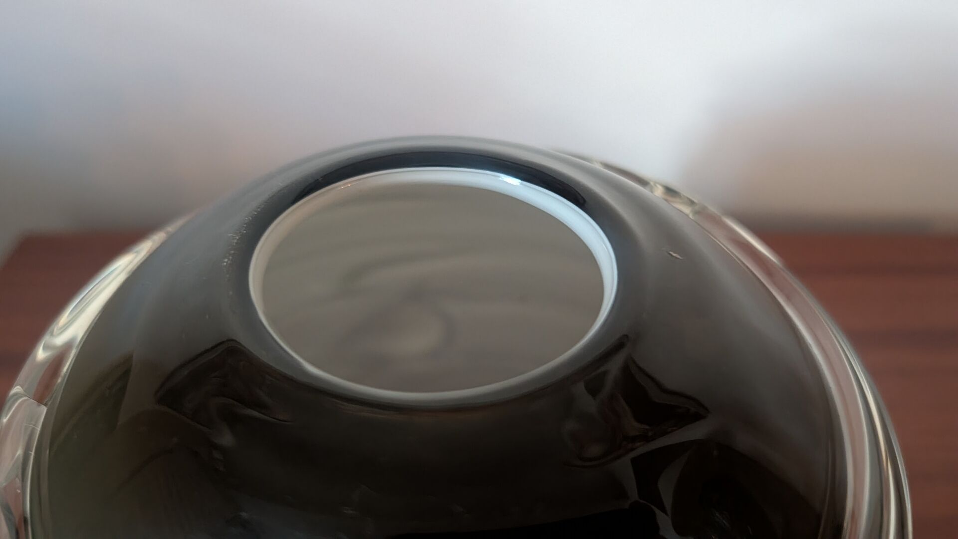 Smoky glass spherical vase with spiral applications from the 1970s.