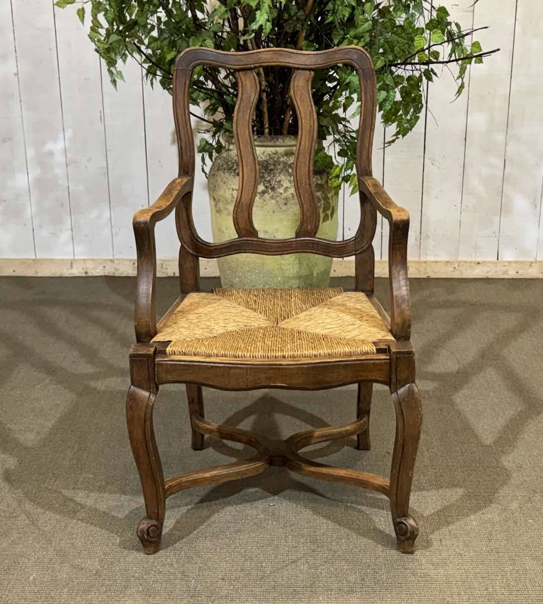 20th-century armchair in beech with a straw seat in Louis XV style.