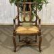 20th-century armchair in beech with a straw seat in Louis XV style.