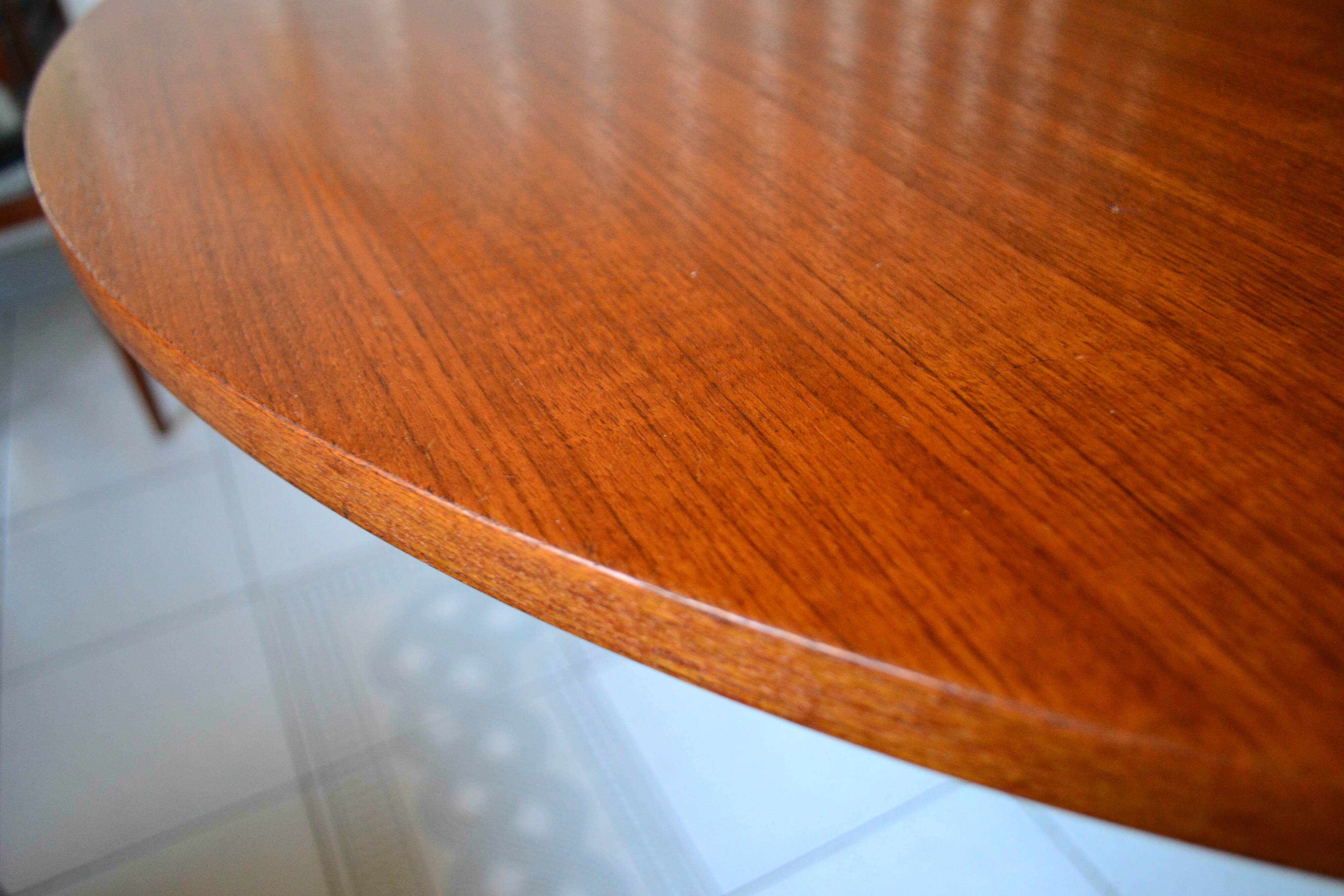 Dining table Pierre Guariche, teak and black steel from the 1960s with extension.