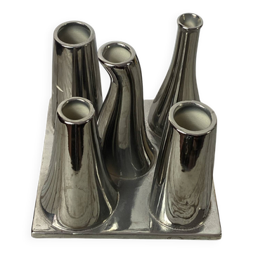 Asymmetrical multitube vase on a base, in silvered ceramic, 1970.