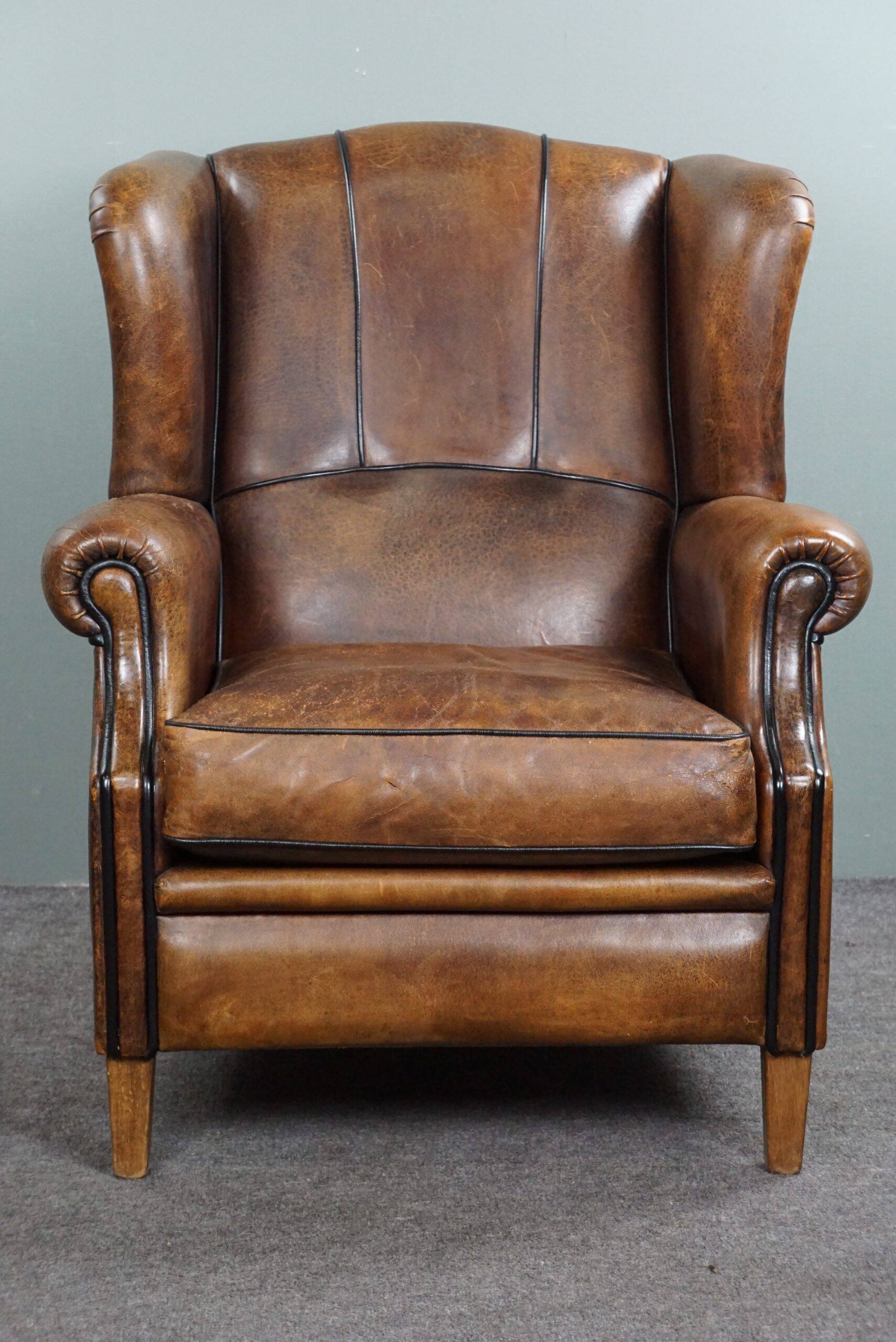 Fauteuil à oreilles en cuir de mouton
