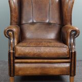 Fauteuil à oreilles en cuir de mouton