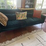 Dark green velvet sofa