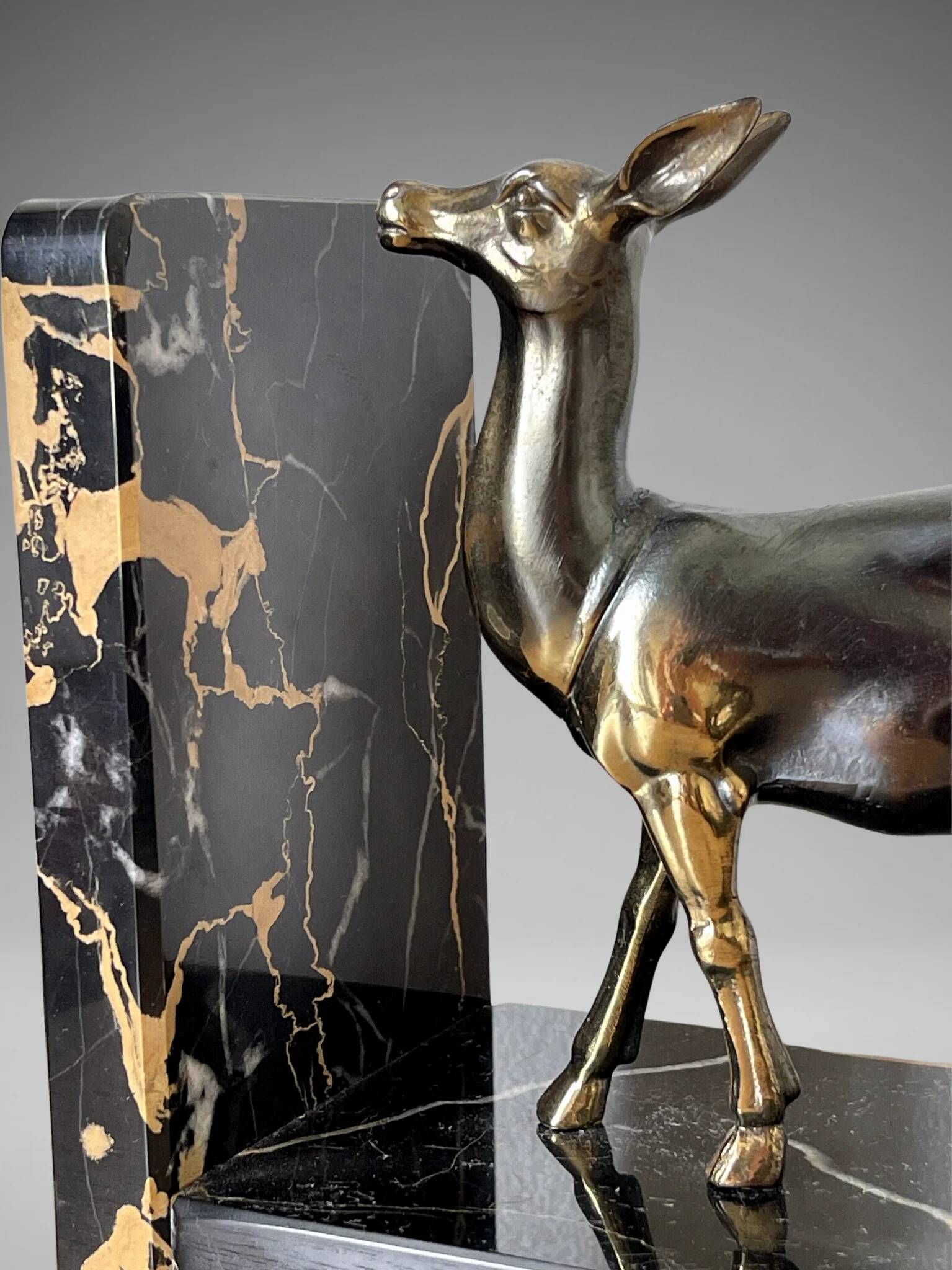 Pair of deer bookends in black marble and gold metal – Art Deco style