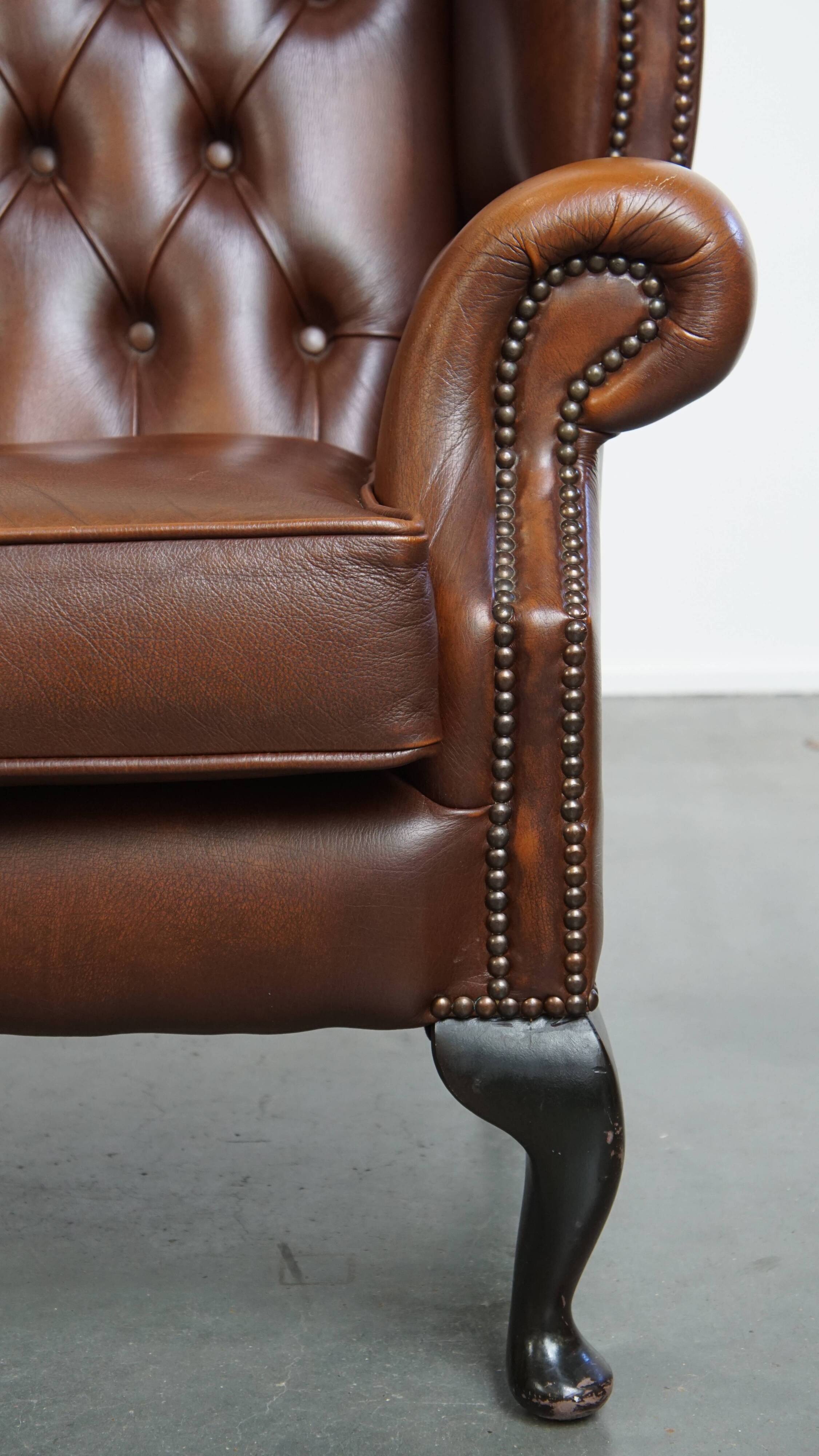 Chesterfield wing chair in dark brown English cowhide