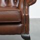Chesterfield wing chair in dark brown English cowhide