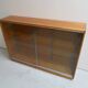 Vintage shop display cabinet with sliding doors
