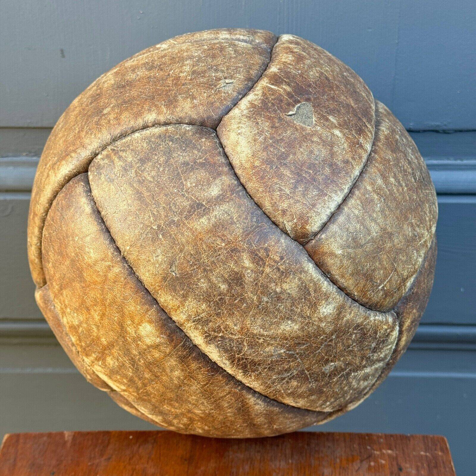 Mid-20th century leather soccer ball with visible stitching and beautiful patina